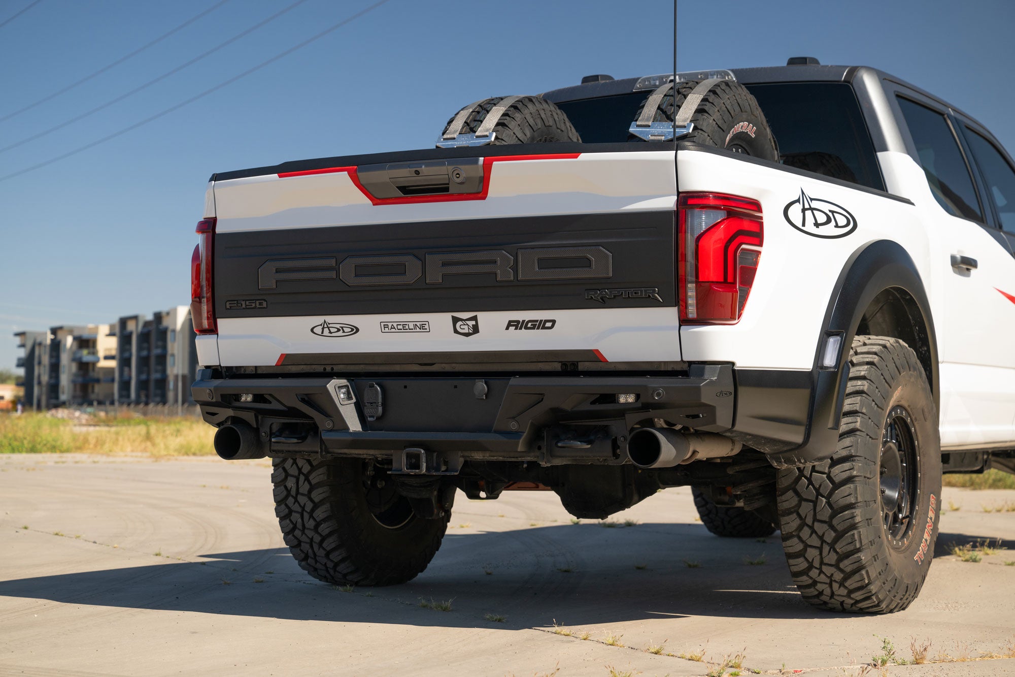 Back view of a 2021+ Ford F-150 Raptor ADD Edge Rear Bumper on a clear day.