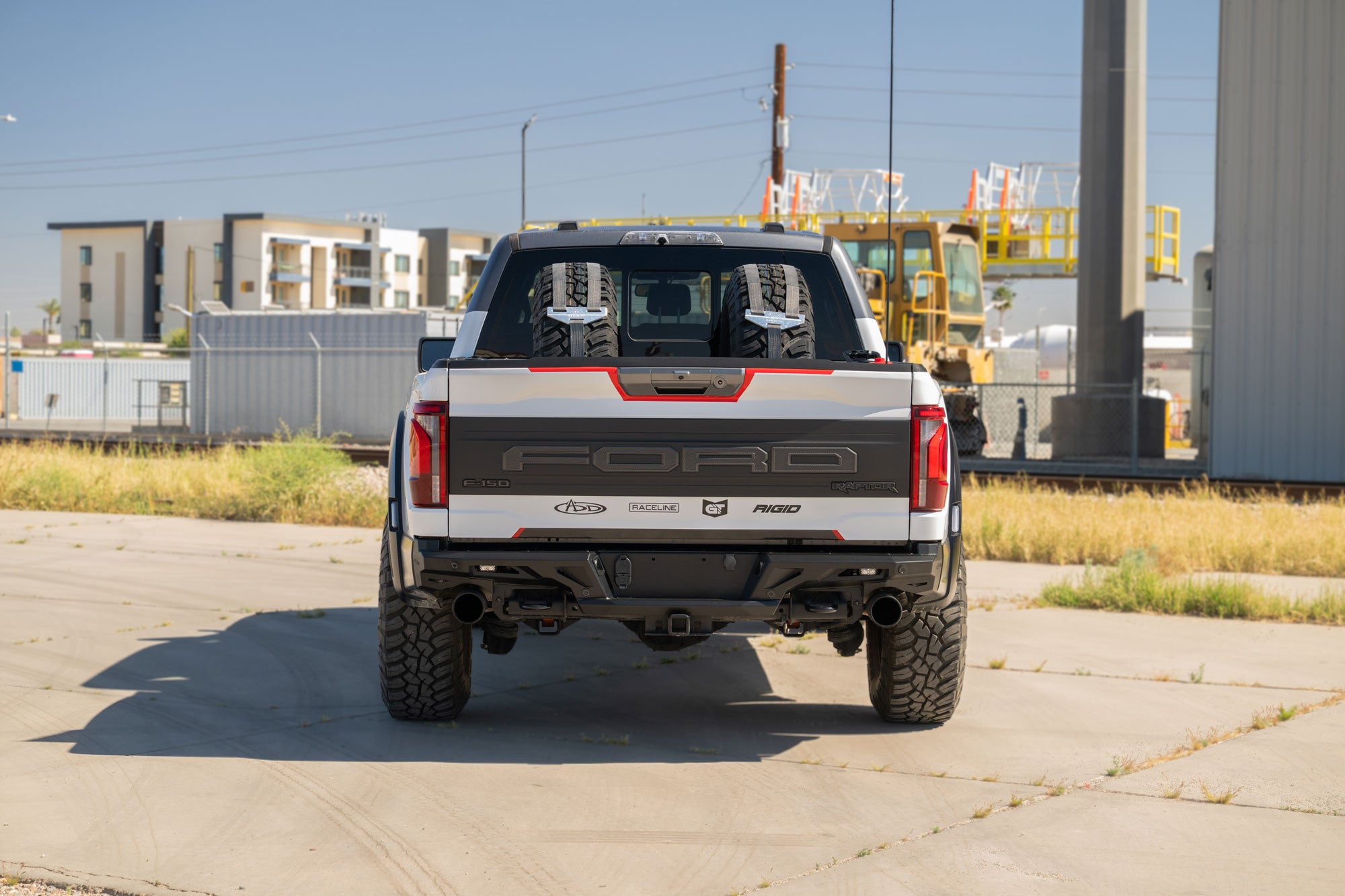 Back view of 2021+ Ford F-150 Raptor ADD Edge Rear Bumper in an industrial setting