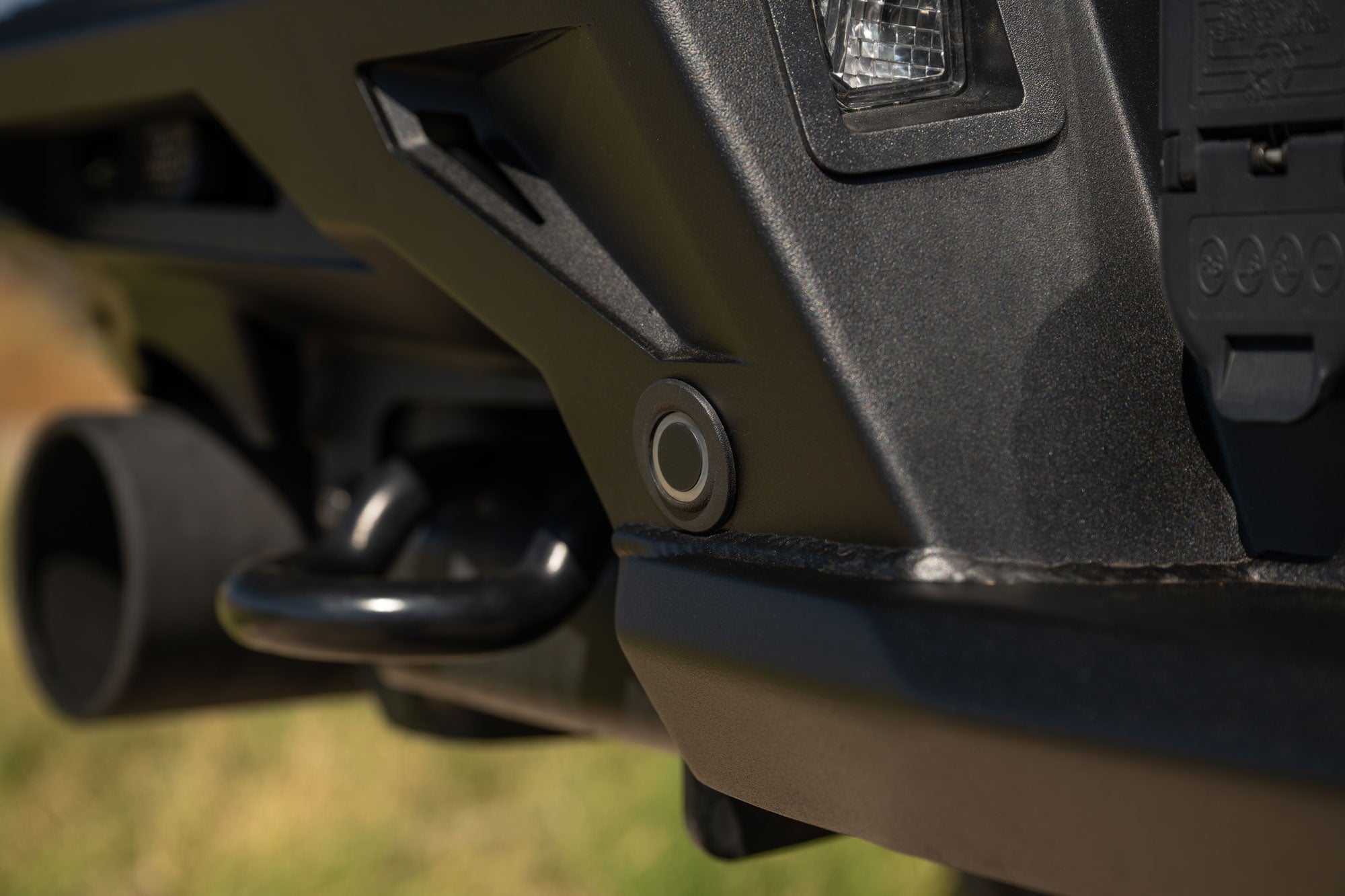 Close-up of the OEM sensor used on the 2021+ Ford F-150 Raptor ADD Edge Rear Bumper