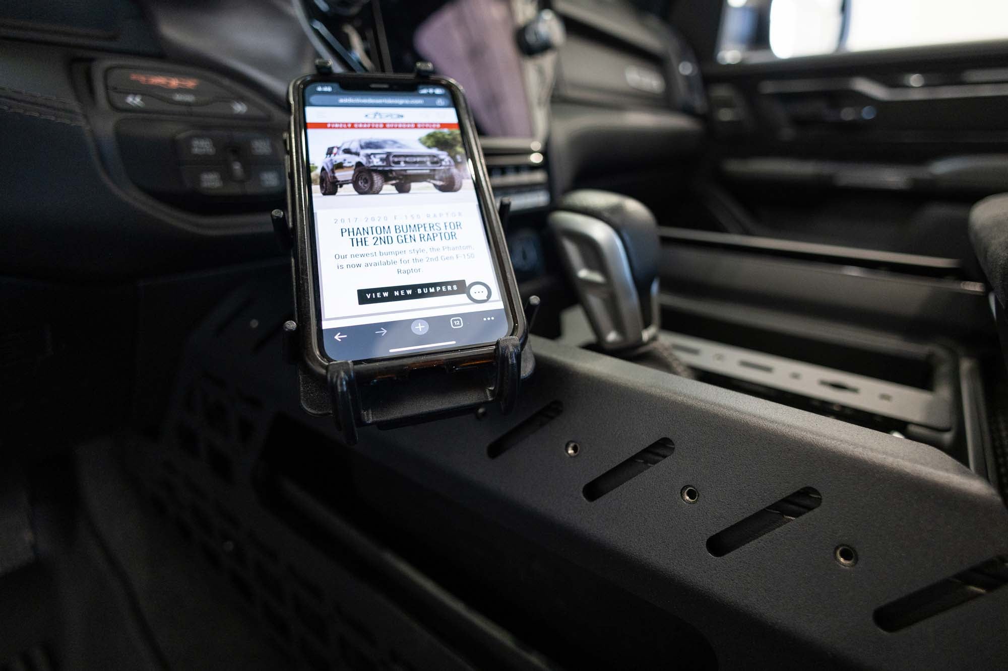 Phone mounted to the Center Console Molle Panels & Digital Device Bridge for the 2021+ Ram 1500 TRX 