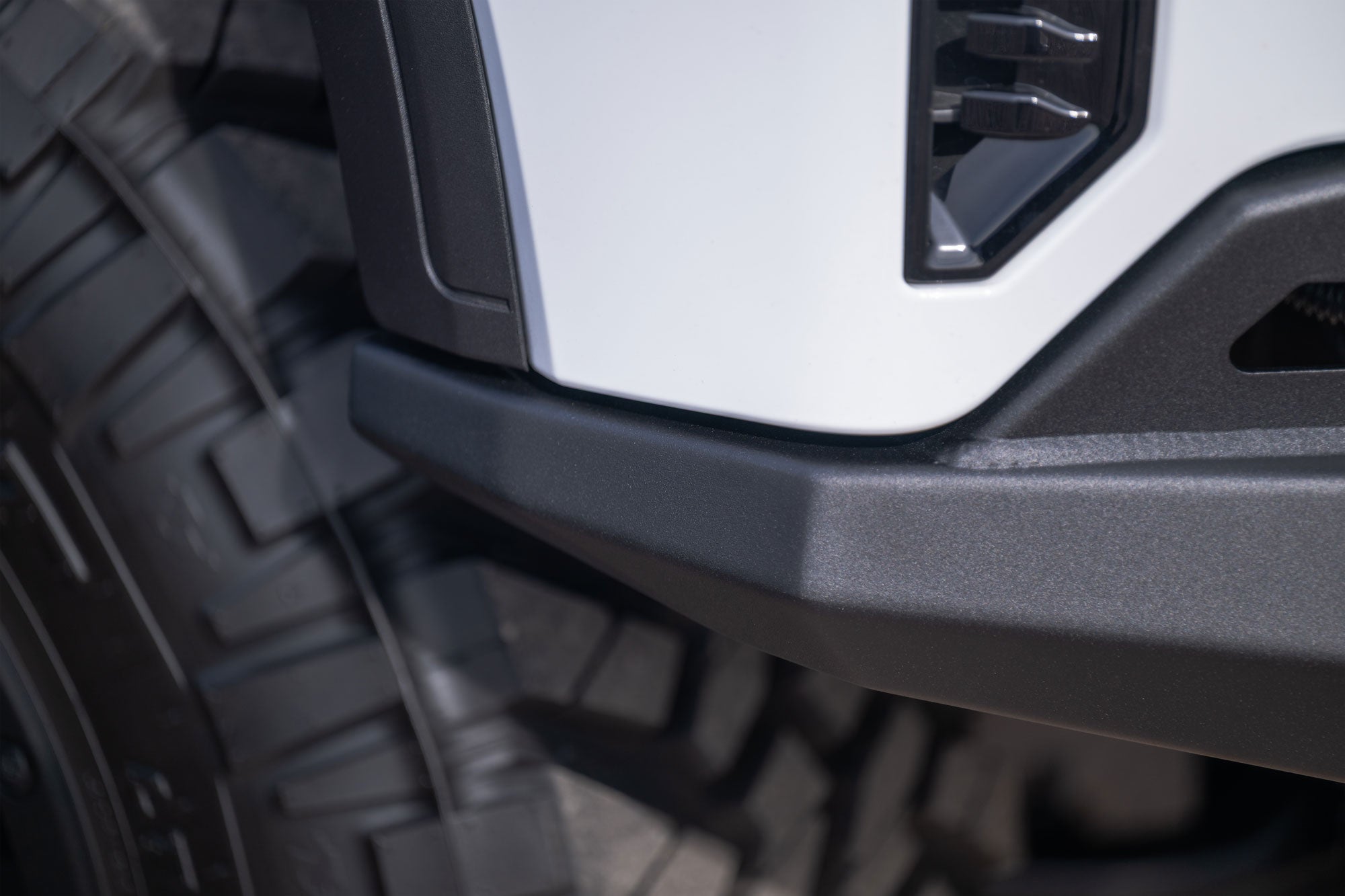 Close-up of a GMC Sierra 1500 with Stealth Fighter Front Bumper showing the perfect fitment