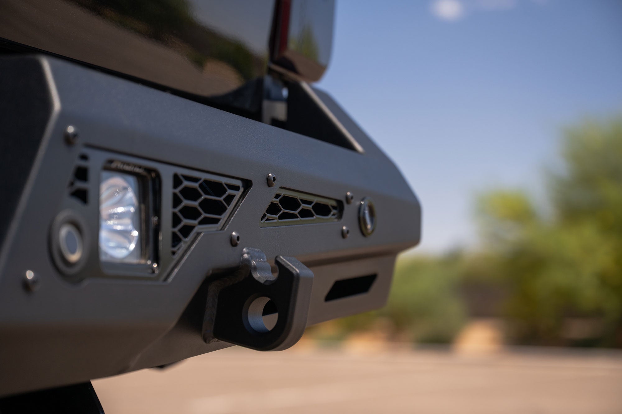 Close-up of Clevis Mount on a Stealth Fighter Rear Bumper for 2023-2026 Ford Super Duty with a blurred natural background