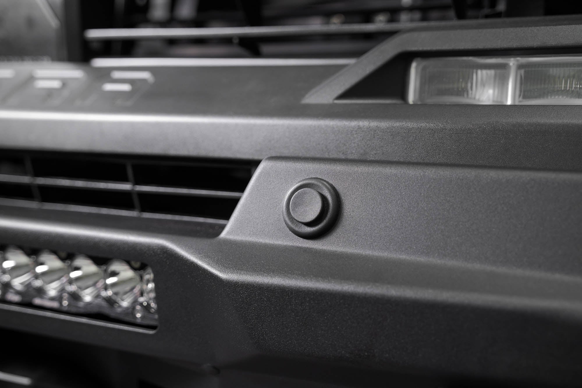 The Stealth Center Mount Front Bumper w Top Hoop for the 3rd Gen Toyota Tundra retains parking sensors.