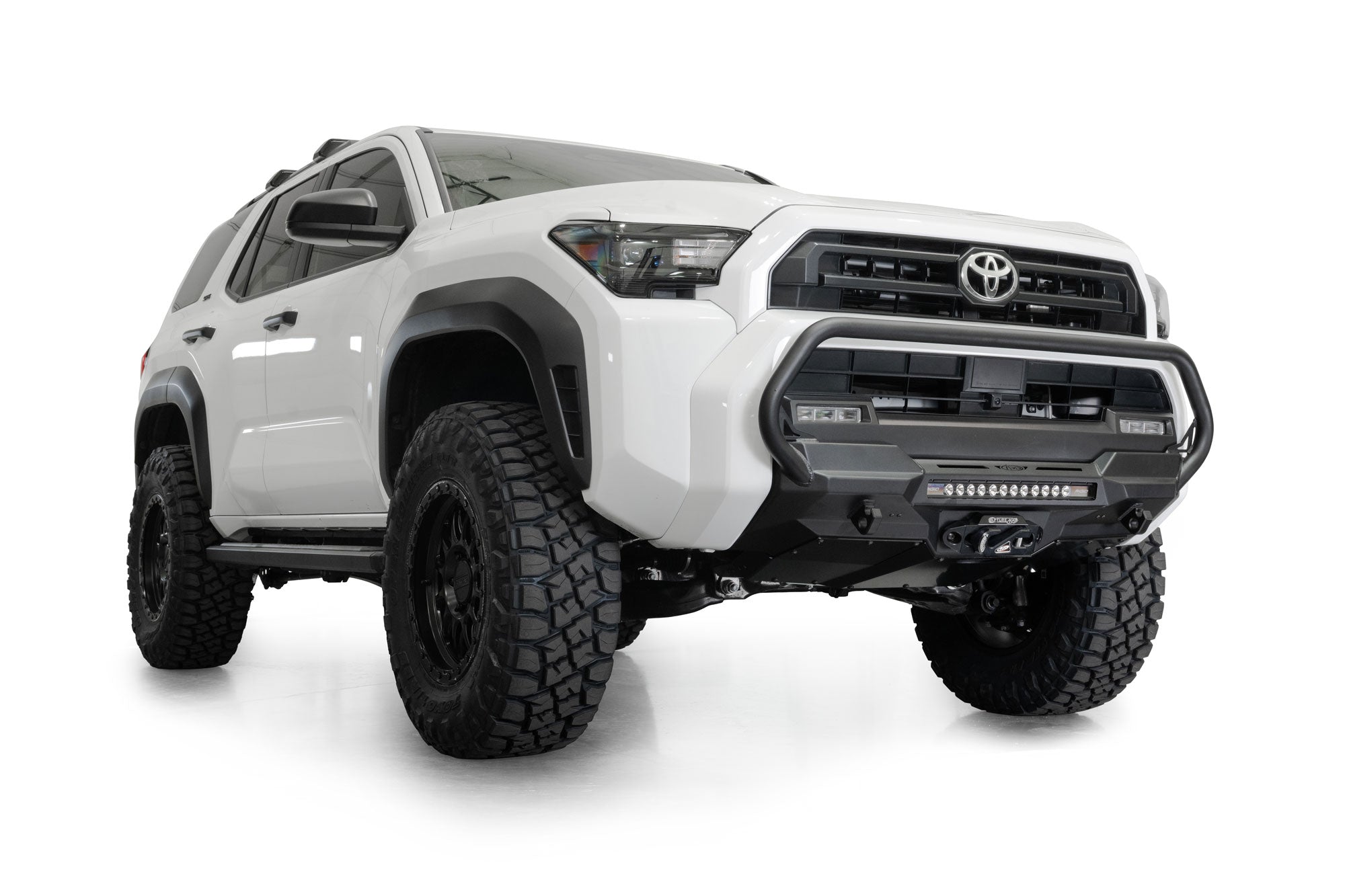 2025 Toyota 4Runner Stealth Center Mount Front Bumper with Top Hoop with lifted suspension and off-road tires on a white background