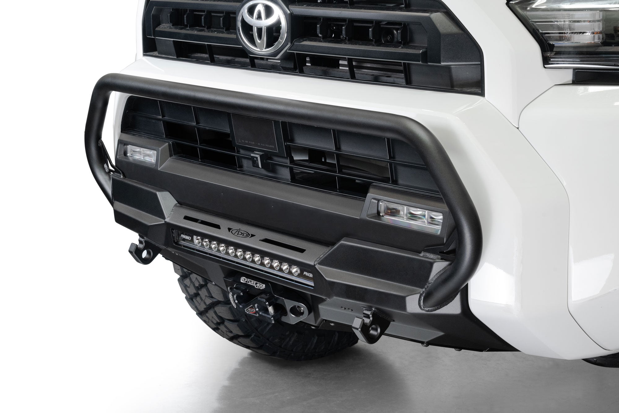 Close-up of a 2025 Toyota 4Runner Stealth Center Mount Front Bumper with Top Hoop on a white background