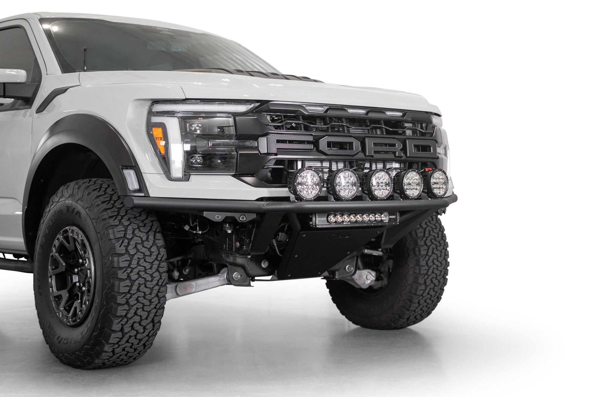 2021+ Ford F-150 Raptor Pro Plus Frame Cut Front Bumper installed on white Ford