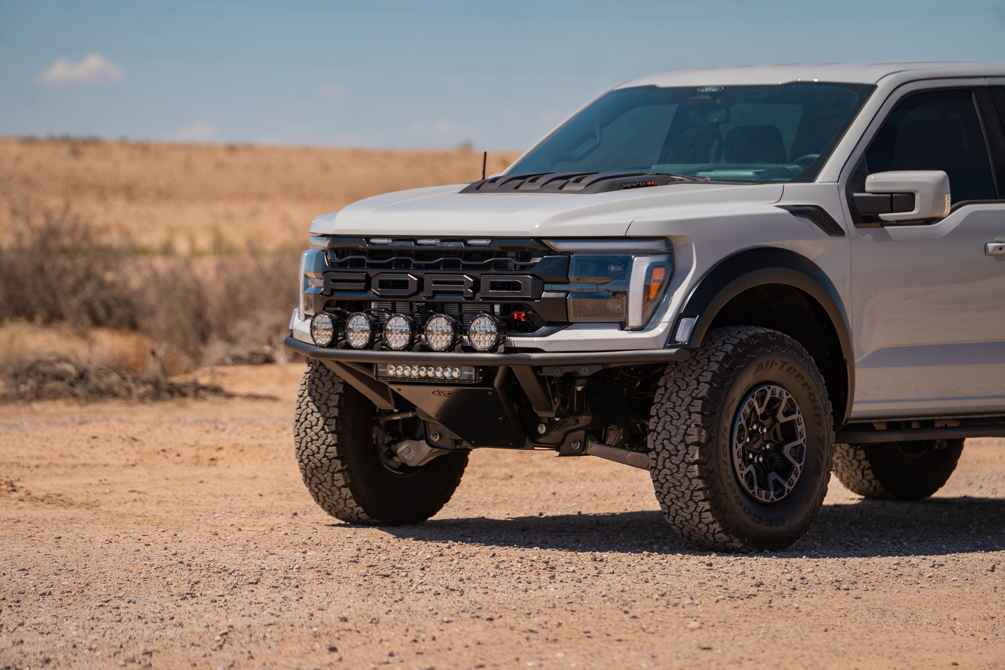 Ford Raptor truck with 2021+ Ford F-150 Raptor Pro Plus Frame Cut Front Bumper installed