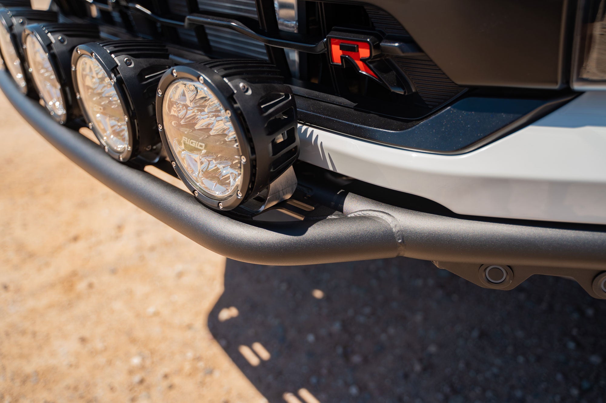 2021+ Ford F-150 Raptor Pro Plus Frame Cut Front Bumper installed with Rigid Industries auxiliary lighting