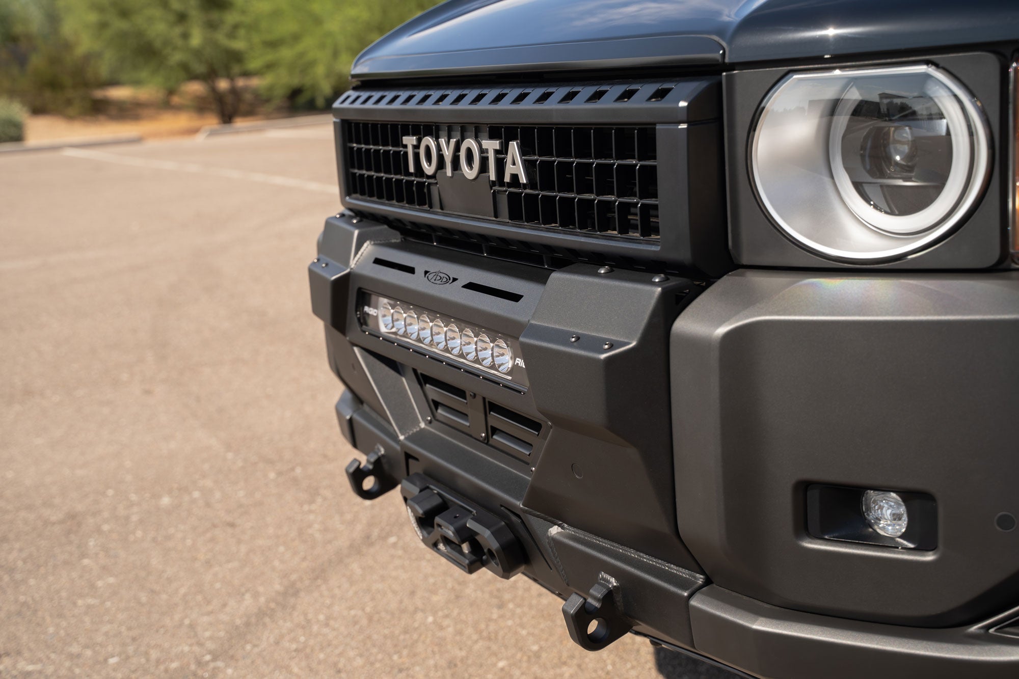 View of installed Stealth Center Mount Winch Front Bumper for 2024 and newer Toyota Land Cruisers with light bar and winch installed