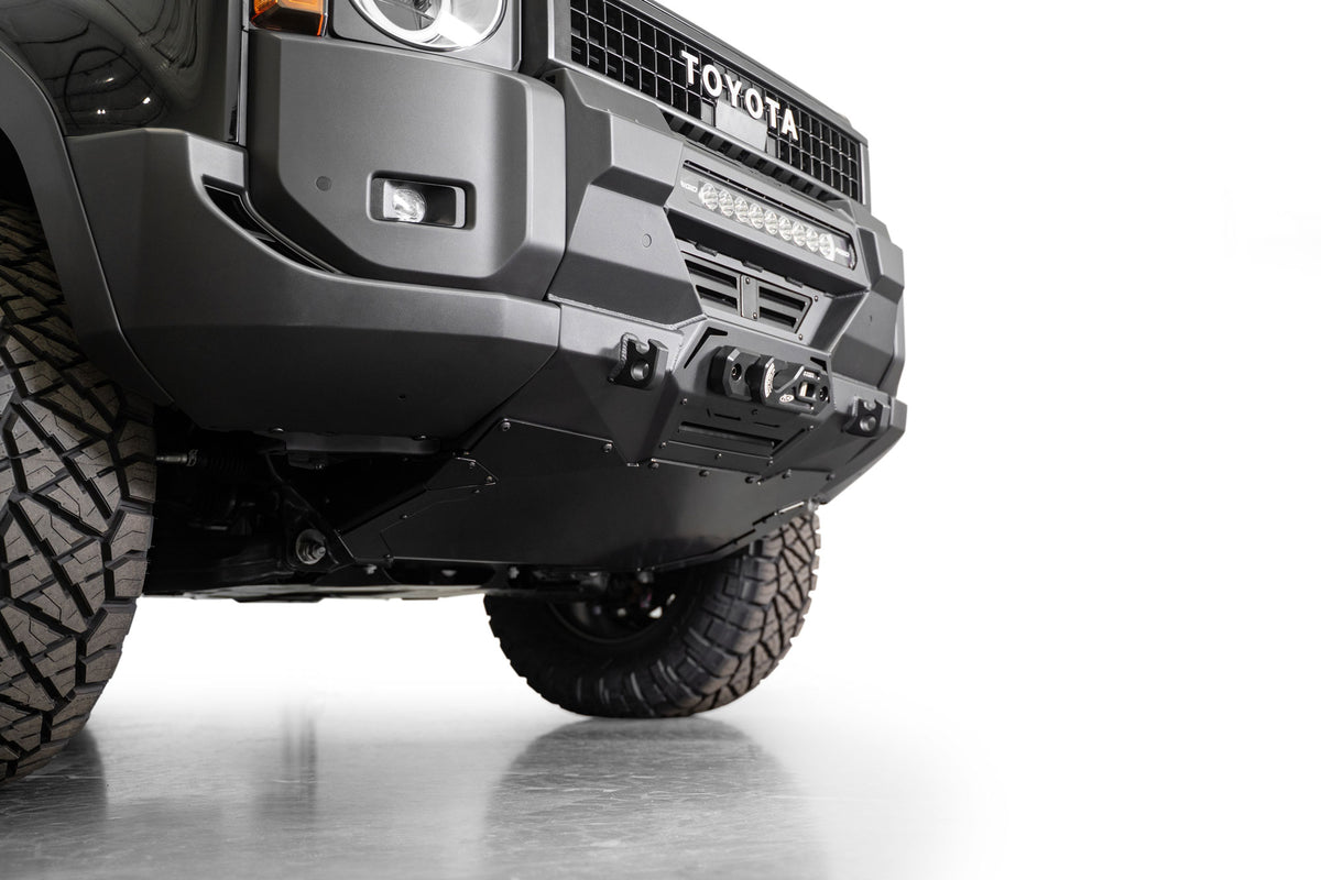 Low angle view of Toyota Land Cruiser Stealth Center Mount Winch Front Bumper for 2024 and newer vehicles installed with skid plate