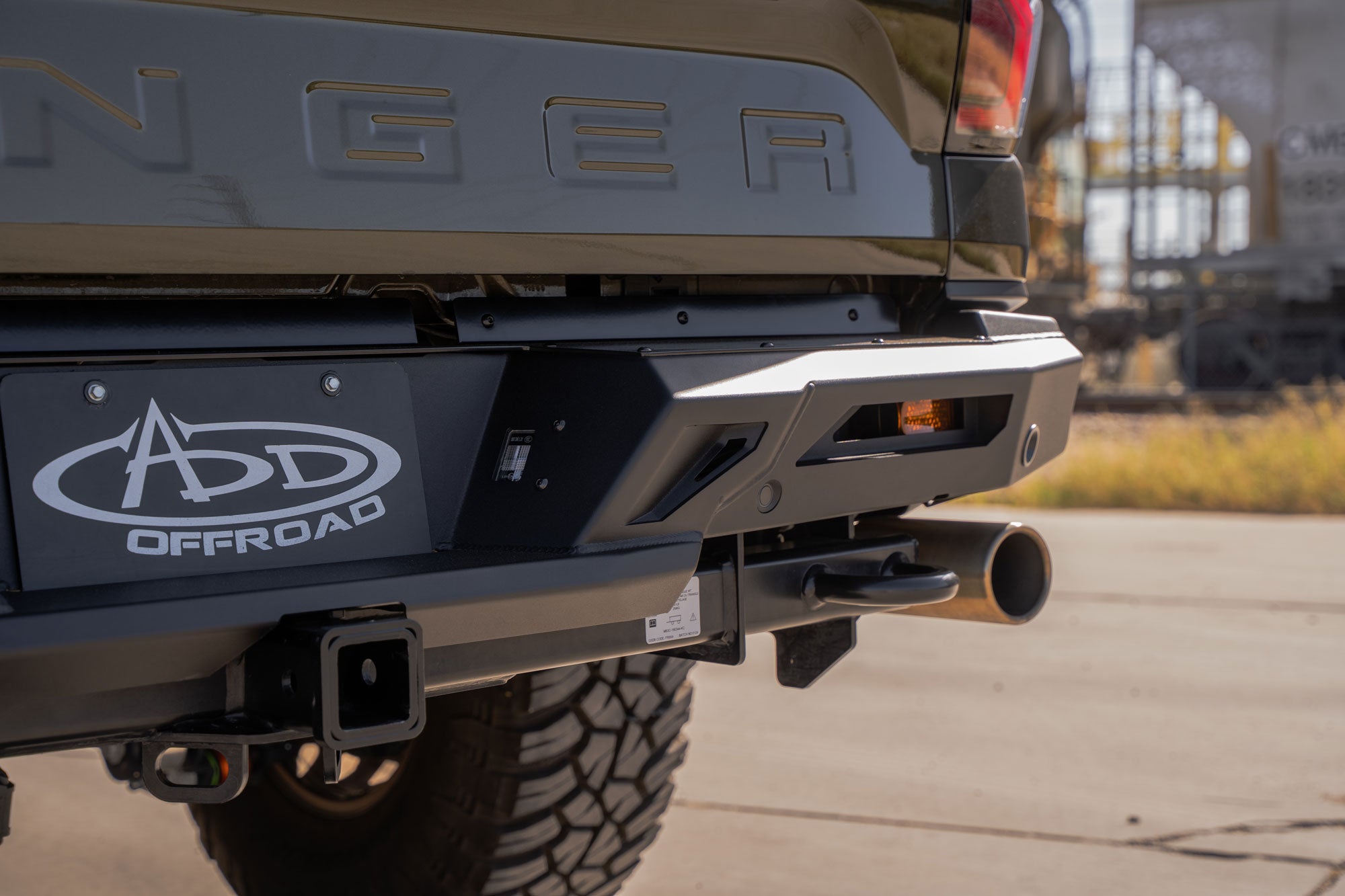 Sunlight highlights the edges of the ADD Edge Rear Bumper for the Ford Ranger Raptor