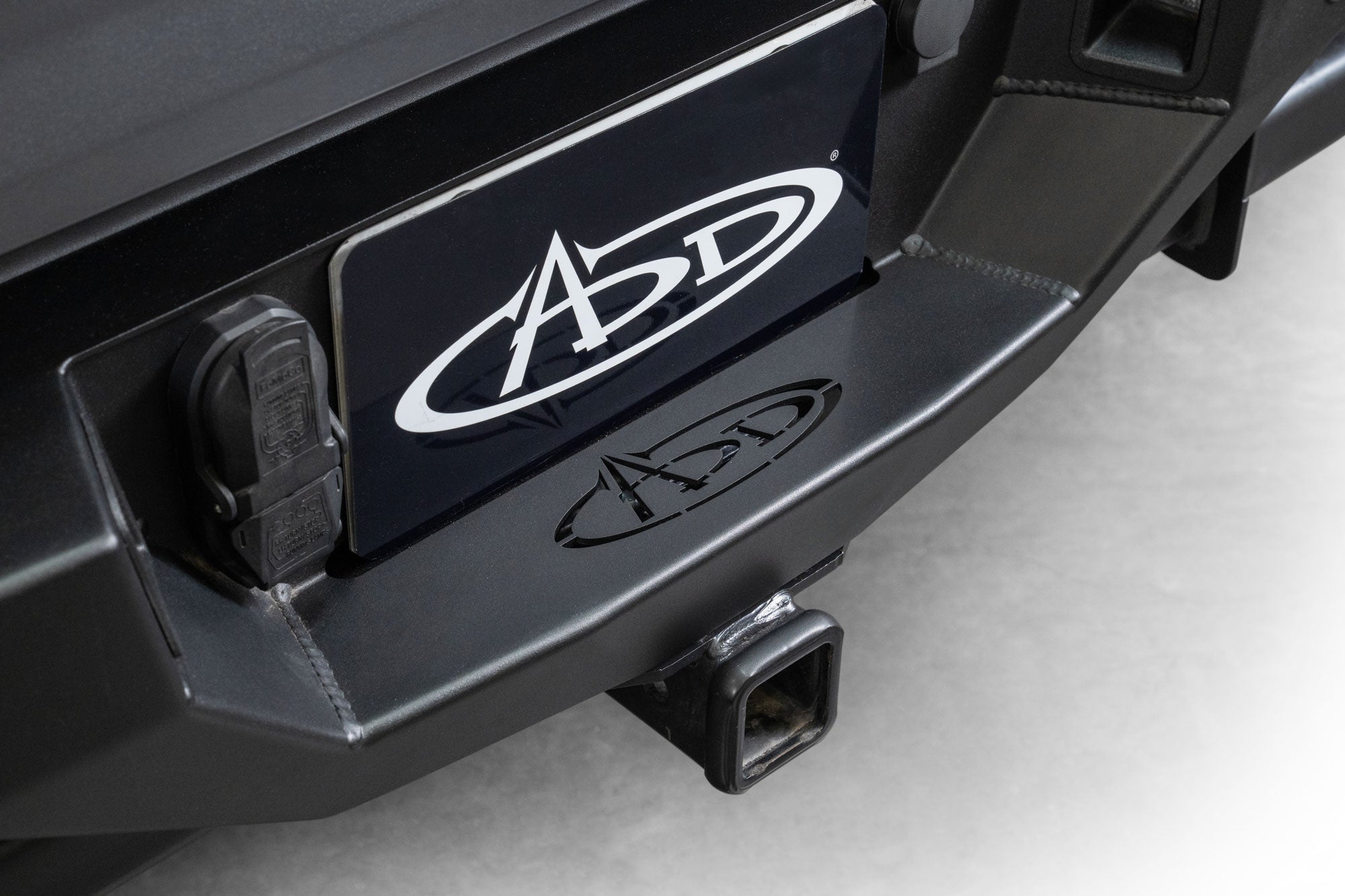 Image of installed Ford F-150 Bomber Rear Bumper with logo cut-out