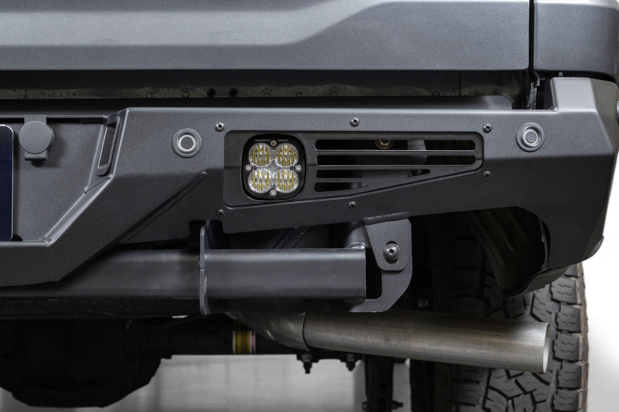 Detail view of the lighting provision with installed light from Baja Designs and sensor adapters on the 2024+ Ford F-150 Bomber Rear Bumper 