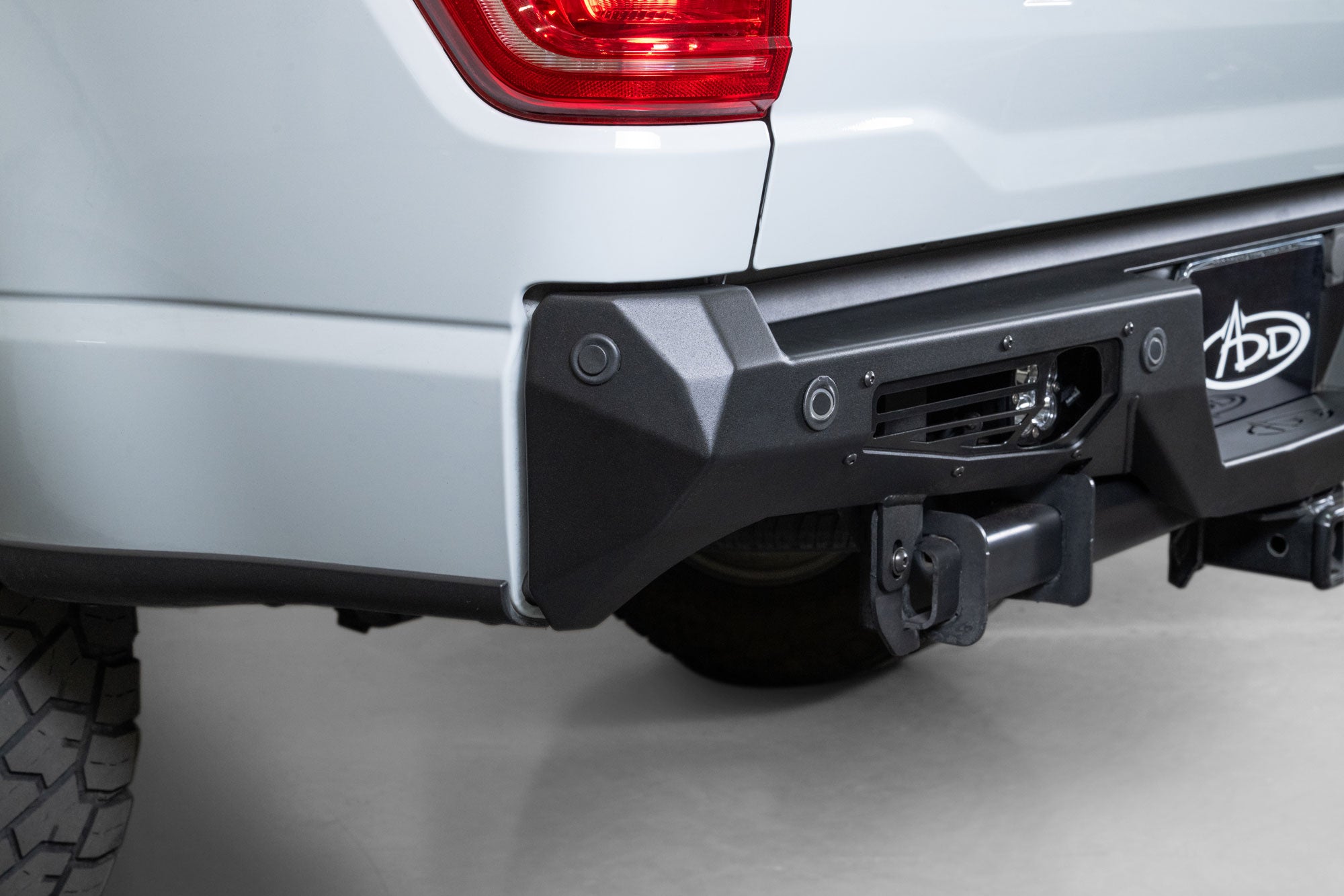 Angled view of Ford F-150 Bomber Rear Bumper showing lighting provisions and OEM sensor functionality