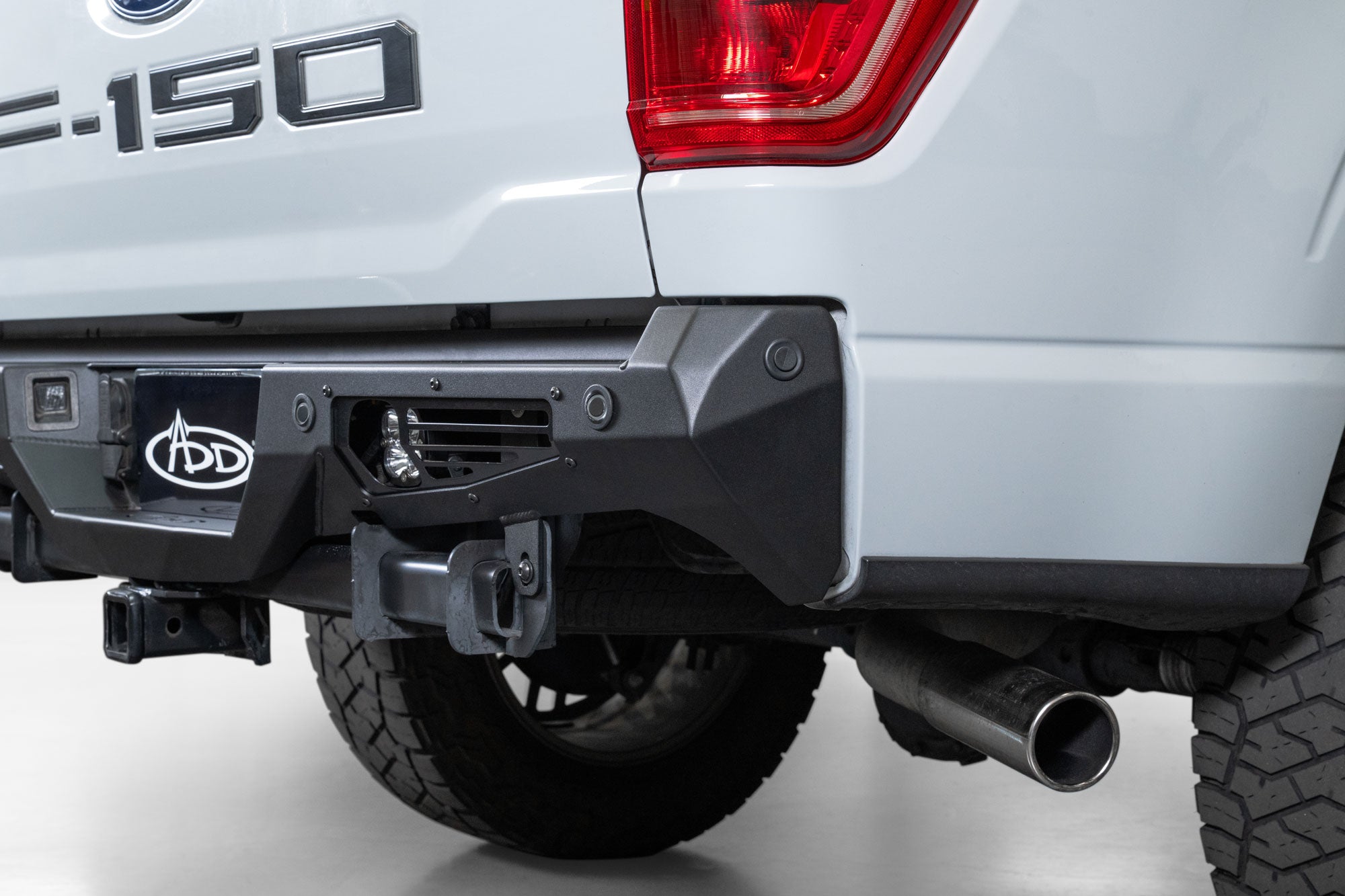 Angled view of Ford F-150 Bomber Rear Bumper with rear lighting provisions and OEM sensor functionality