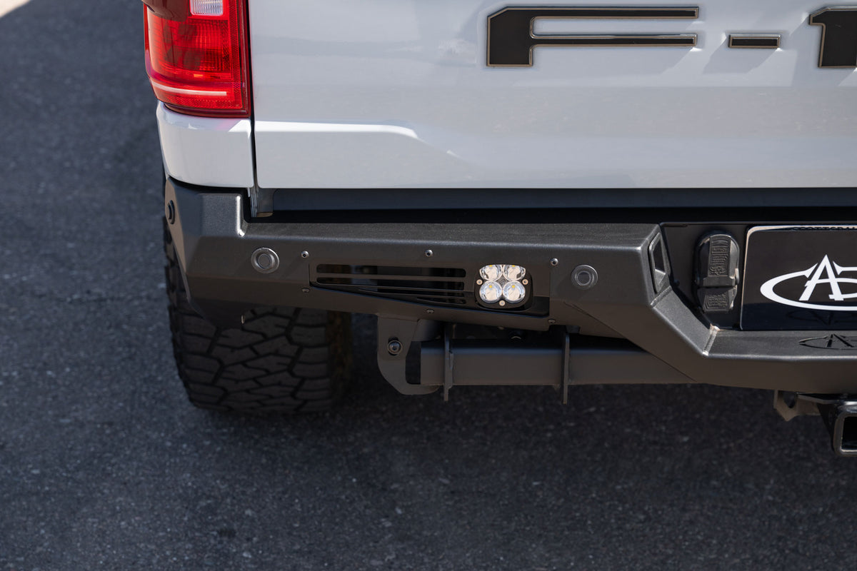 Close shot of the driver side of installed Ford F-150 Bomber Rear Bumper with Baja Designs side light installed