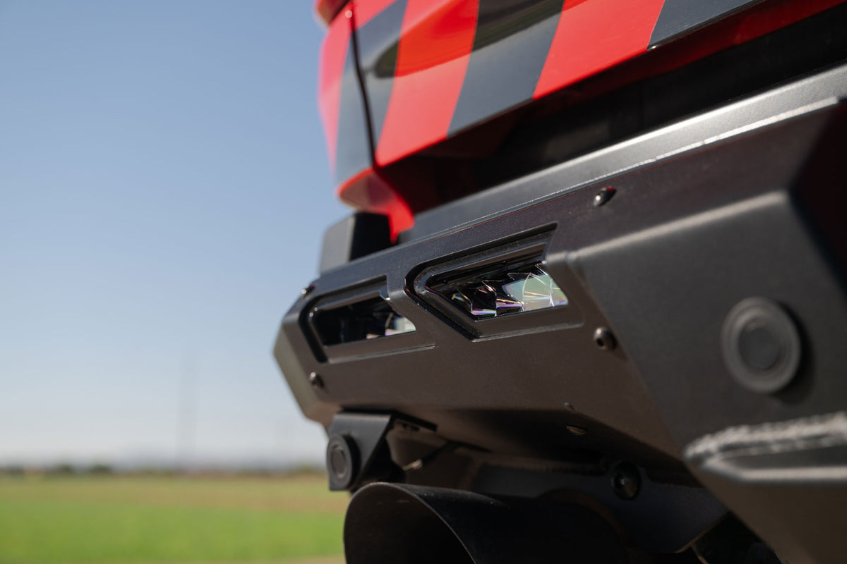 Detailed shot of the 10" side lights behind the Phantom Rear Bumper accent panel cutouts for the RAM RHO.